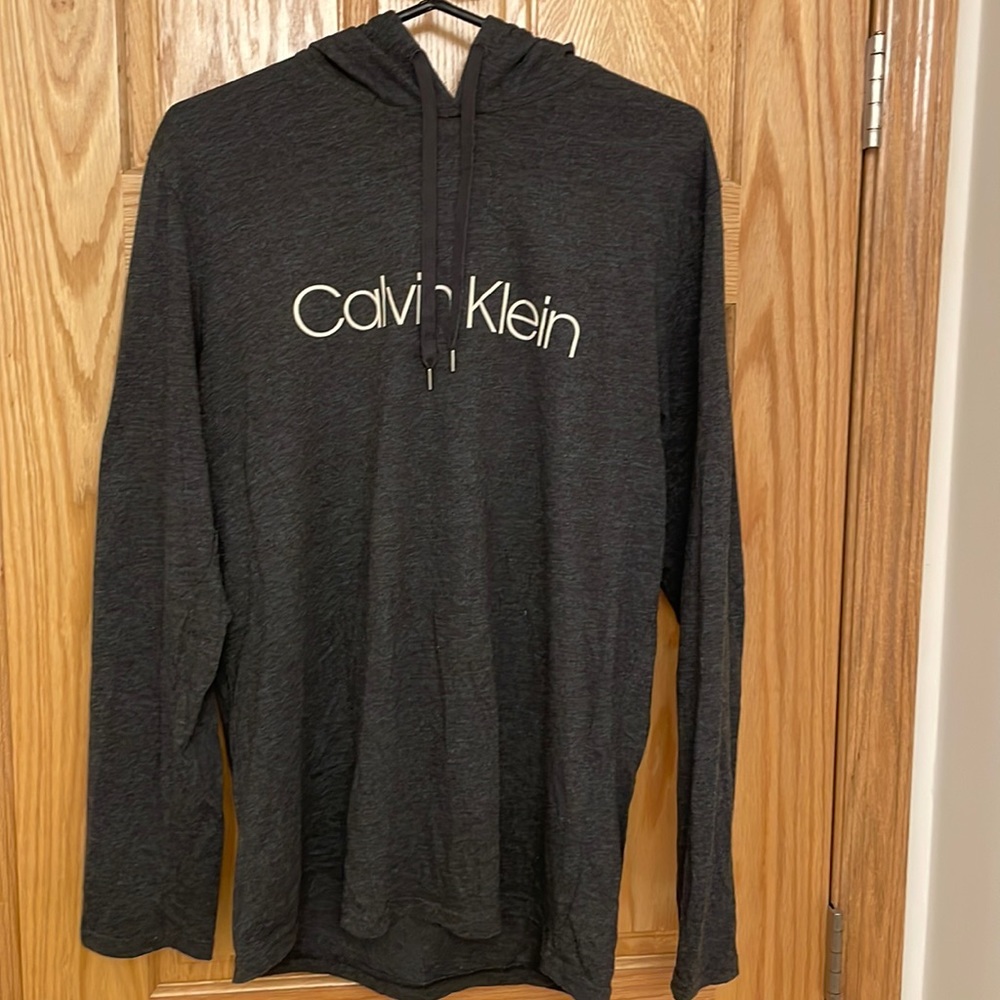 Medium Dark Grey long sleeve hooded Calvin Klein tee.